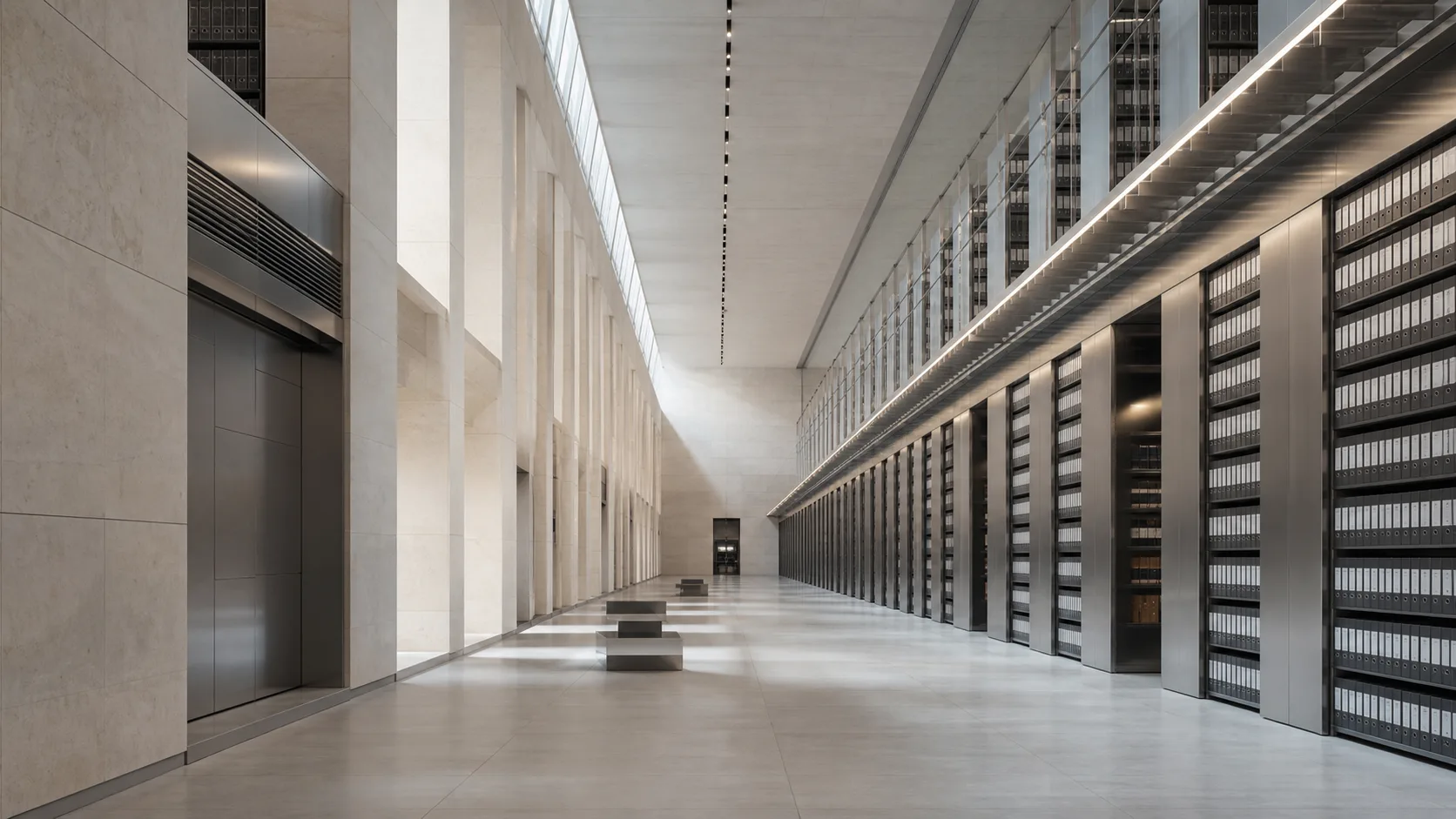 A monumental archive hall with repeating stone columns and organized shelving
